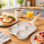 Egg pan with breakfast muffins and mini pancakes on the table