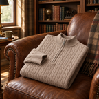 Beige knit polo folded on a leather armchair in a study