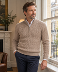 Man wearing the beige Pemberton half-zip soft knit polo in a London townhouse
