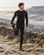 Man in the black Cairnmore thermal base layer set before a winter hike in the Peak District